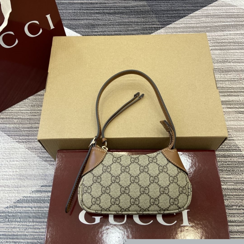 G*u*i top handle bags